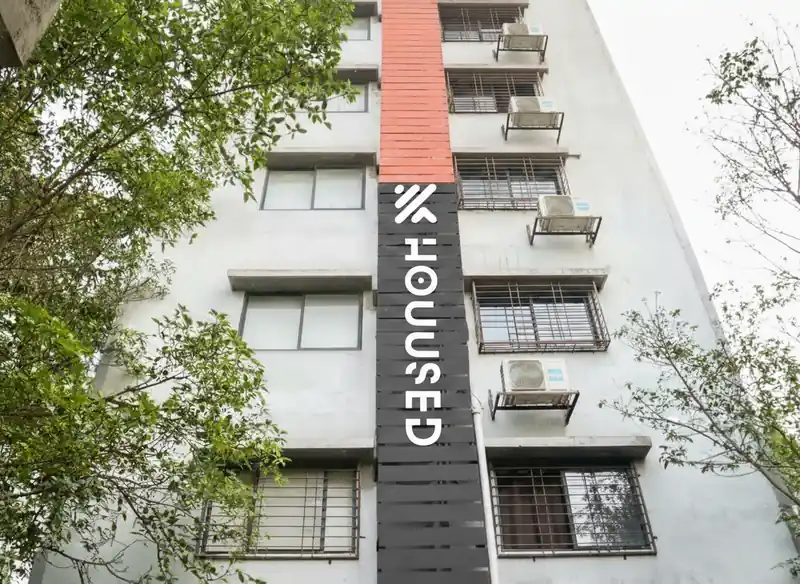 Housed Infinity PG building with the vertical Housed sign